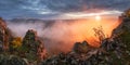 Mountain valley during sunrise. Natural summer landscape with fog