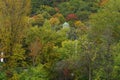 A mountain view of beautiful fall green, orange, and yellow trees and leaves Royalty Free Stock Photo