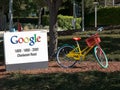 MOUNTAIN VIEW, CA, USA - AUGUST 28, 2015: close up of a sign and bicycle outside google headquarters building Royalty Free Stock Photo