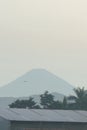 A mountain view from a distance and there is a vast expanse of rice fields. Royalty Free Stock Photo