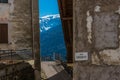 Mountain view form narrow street between old houses. Trento, Italy, Europe.