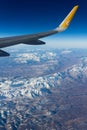 Mountain view from plane wing Royalty Free Stock Photo