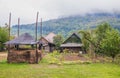 Mountain from view with small village and flow fog. Foggy summer morning in the mountains and a small village. Country road in the Royalty Free Stock Photo