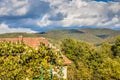 Mountain from view with small village sunny day. Sunny summer morning in the mountains and a small village. Country road in the Royalty Free Stock Photo