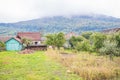 Mountain from view with small village sunny day. Sunny summer morning in the mountains and a small village. Country road in the Royalty Free Stock Photo