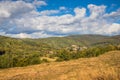 Mountain from view with small village sunny day. Sunny summer morning in the mountains and a small village. Country road in the Royalty Free Stock Photo