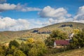 Mountain from view with small village sunny day. Sunny summer morning in the mountains and a small village. Country road in the Royalty Free Stock Photo