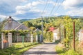 Mountain from view with small village sunny day. Sunny summer morning in the mountains and a small village. Country road in the Royalty Free Stock Photo