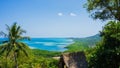 Mountain view with stone and green tree forest and blue sea water in distance in karimun jawa Royalty Free Stock Photo