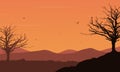 Mountain view with tree silhouette, with birds flying under the orange sky. Vector illustration Royalty Free Stock Photo