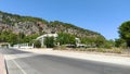 Mountain view in turkey, building near the highway with pine thickets in the mountains