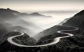 Mountain view. Winding road stretching into the distance. Serpent road in foggy valley. Black and white cinematic horizontal