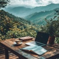 Mountain View Work Station with Laptop, Coffee, and Open Book Royalty Free Stock Photo