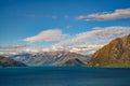 Mountain views and Lake Hawea. In summer there are green grass and blue skies with beautiful clouds Royalty Free Stock Photo