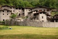 Mountain village architecture in Italy. Stone buildings in Camonica Valley Royalty Free Stock Photo