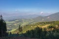 Mountain village, on background on horizon mountain Lysa Hora, on foreground forest cableway for timber concentration uphill,