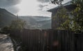 Mountain village, house and fence, view of the valley