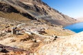 Mountain village town stone buildings old abandoned houses, lake, Bolivia.