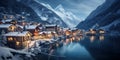 Mountain village at winter night, landscape of ski resort by lake, small town covered snow in evening lights on Christmas. Theme Royalty Free Stock Photo