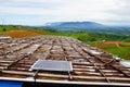 Mountain villages used solar cell to produce electricity for use with electric lampsThe back is a wind power plant that produces Royalty Free Stock Photo