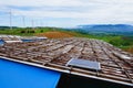 Mountain villages used solar cell to produce electricity for use with electric lampsThe back is a wind power plant that produces Royalty Free Stock Photo