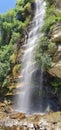 Mountain water fall with bushes Royalty Free Stock Photo