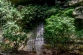 Mountain with waterfall and river in the tropical jungles in Gunung Mulu National park. Royalty Free Stock Photo