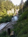Mountain waterfall Salt de Rebet in forest, Braone Valley, Italy