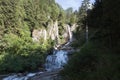 Mountain waterfall Salt de Rebet in forest, Braone Valley, Italy