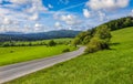 Mountain winding road in a green valley Royalty Free Stock Photo