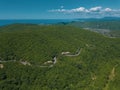 Mountain winding zig zag road. Top aerial view: cars driving on road from above. Royalty Free Stock Photo