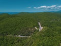 Mountain winding zig zag road. Top aerial view: cars driving on road from above. Royalty Free Stock Photo
