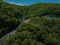 Mountain winding zig zag road. Top aerial view: cars driving on road from above. Royalty Free Stock Photo