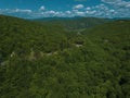 Mountain winding zig zag road. Top aerial view: cars driving on road from above. Royalty Free Stock Photo