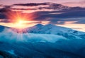 Mountain winter landscape. Fantastic evening glowing by sunlight.