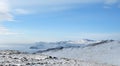 Mountain winter landscape. with high hills Olkhon offers beautiful views of Lake Baikal, covered with ice. Snow-capped mountains Royalty Free Stock Photo