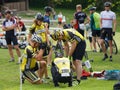 Mountainbike team fixing the bike before the start in the race Royalty Free Stock Photo