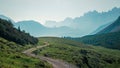 Mountainbiking in the Karwendel mountains in front of blue mountain layers, Austria Royalty Free Stock Photo