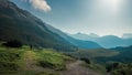 Mountainbiking in the Karwendel mountains in front of blue mountain layers, Austria Royalty Free Stock Photo