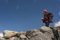 Woman mountaineer alone on rocks