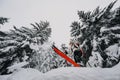 Mountaineer backcountry ski waling two ski alpinist in the mountains. Ski touring in alpine landscape with snowy trees. Adventure