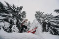 Mountaineer backcountry ski waling two ski alpinist in the mountains. Ski touring in alpine landscape with snowy trees. Adventure