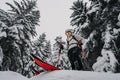 Mountaineer backcountry ski waling two ski alpinist in the mountains. Ski touring in alpine landscape with snowy trees. Adventure