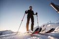 Mountaineer backcountry ski walking in the mountains. Ski touring in high alpine landscape. Adventure winter extreme sport. Sunny