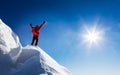 Mountaineer celebrates the conquest of the summit.