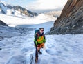 Mountaineer climbing glacier Mont Blanc mountains, France Alps