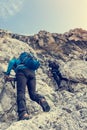 Mountaineer climbing in mouintains. Royalty Free Stock Photo