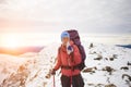 Mountaineer drinks water on top of the mountain. Royalty Free Stock Photo