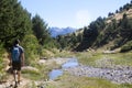 Mountaineer hiking in the mountain with a steam close to him in Pyrenees