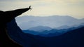 Mountaineer sitting on rocky outcropping